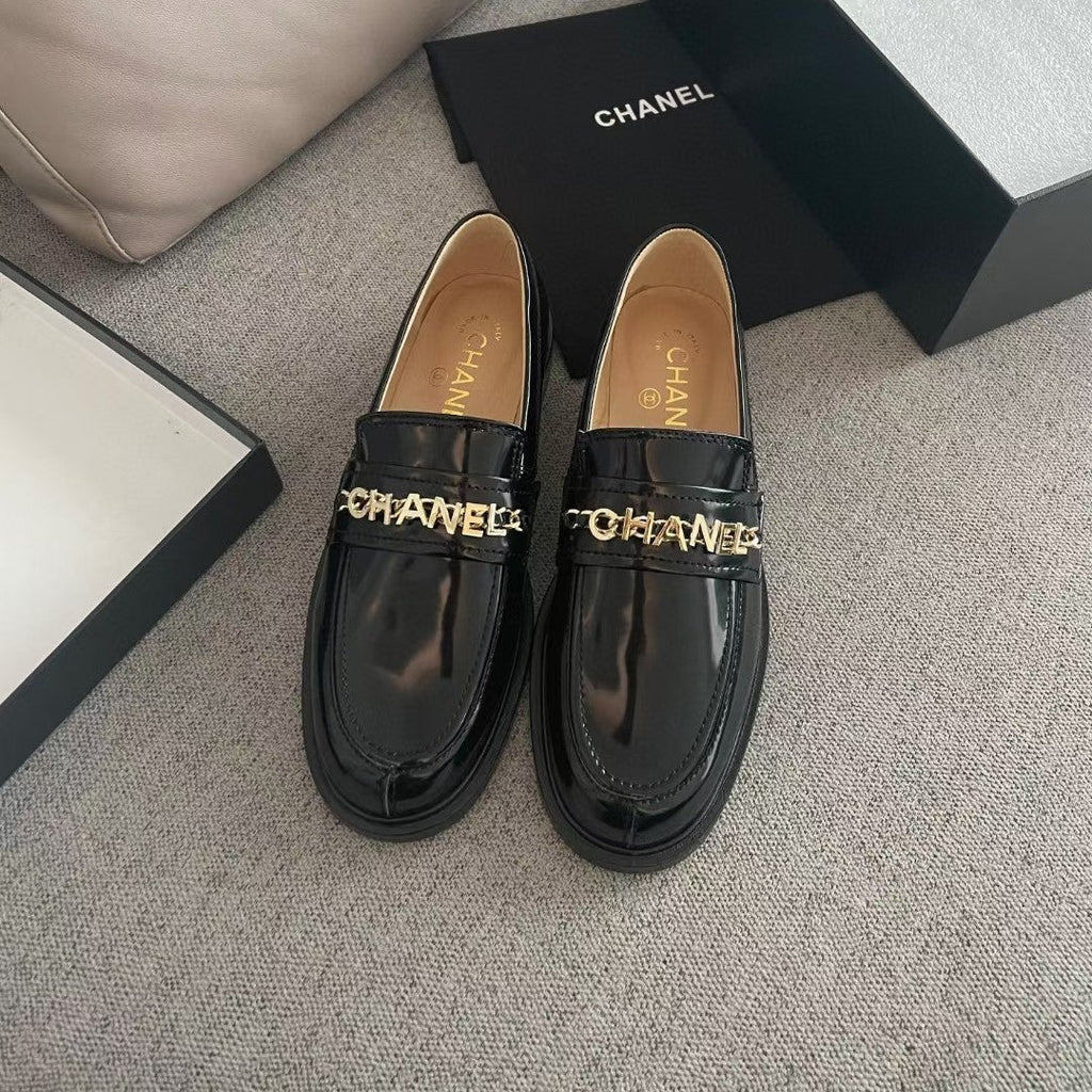 Chanel Moccasins in Black Calfskin Gold Metal Logo