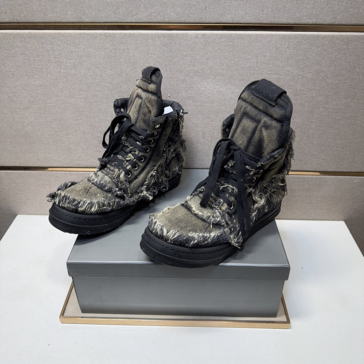 Gray and Black Distressed High-Top Sneakers — model